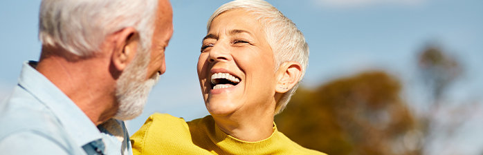 Elderly couple laughing together